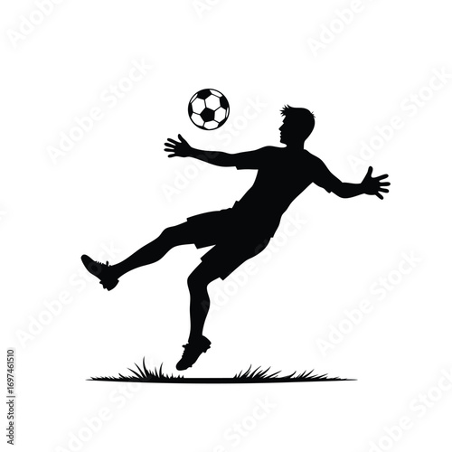 Silhouette of a soccer player kicking a ball in the air Keywords: silhouette, soccer, player