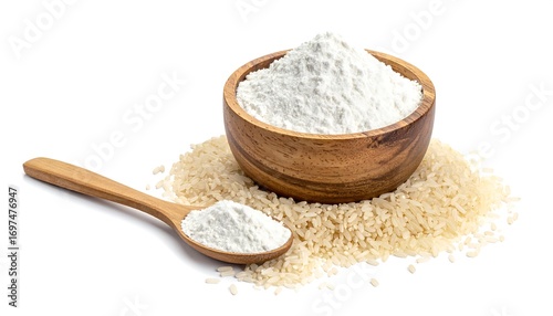 Wooden bowl of rice flour with a wooden spoon and grains of rice