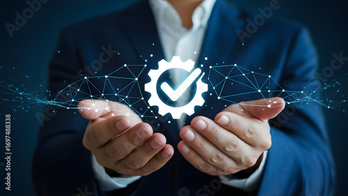 Hand-held Approved Symbol: The image depicts a businessperson holding a digital rendering of a checkmark, symbolizing quality control and a commitment to excellence and high standards.