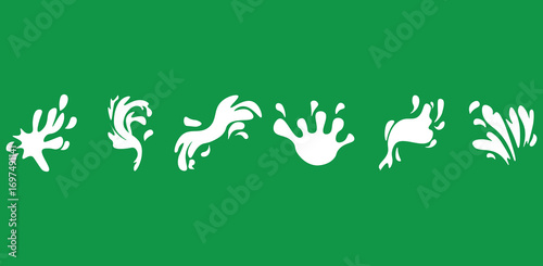 Six white milk splatters form abstract artistic pattern on an emerald background
