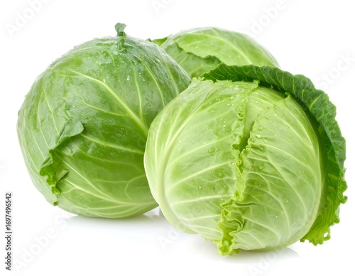 Three fresh cabbages, vibrant green and glistening with water droplets, are displayed against a pure white background.