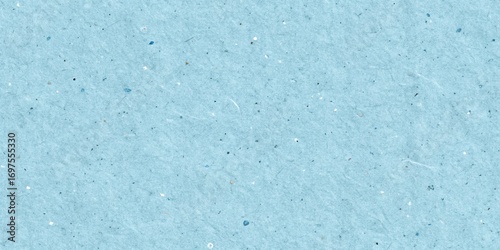 Seamless pastel blue recycled paper texture with subtle fibers and speckles