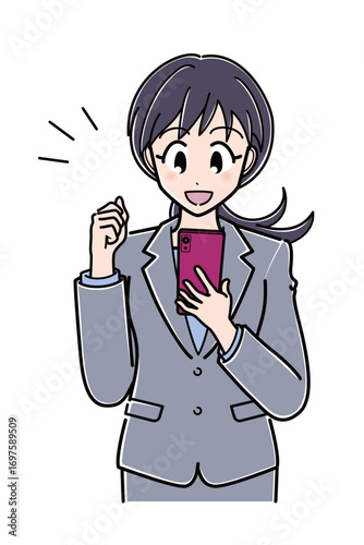 スマートフォンを見ながら拳を握って喜ぶスーツのOLさん（上半身）