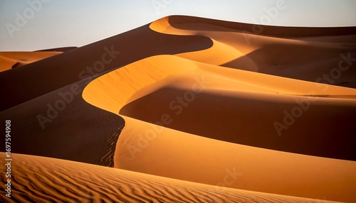 Fototapeta Naklejka Na Ścianę i Meble -  Golden desert dunes at sunrise