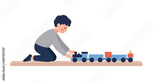 Child's fun work: a little boy playing with a toy train
