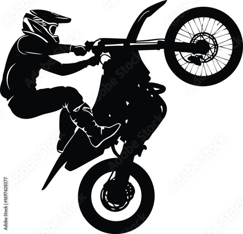 Silhouette of a motocross rider performing a wheelie, showcasing skill and adrenaline