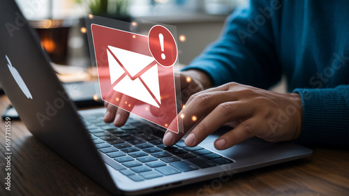 New email notification concept on laptop with exclamation mark and envelope for inbox message alert