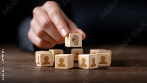 Ai impact on jobs automation wooden block with human icons and artificial intelligence symbol showing workforce change and emotion