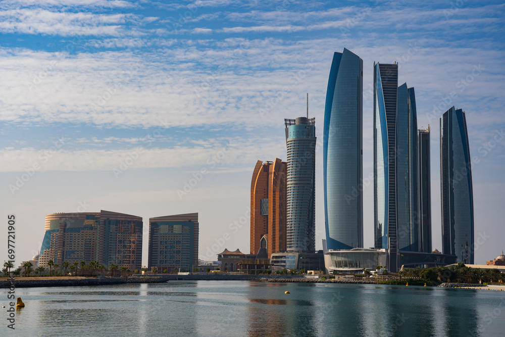 Fototapeta premium A daytime cityscape shows the Etihad Towers skyscrapers in Abu Dhabi, United Arab Emirates. ABU DHABI, UNITED ARAB EMIRATES – November 28, 2020.