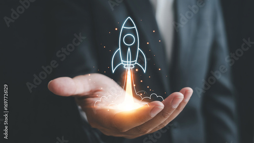 Business startup concept rocket launching from hand investment growth and innovation success strategy idea