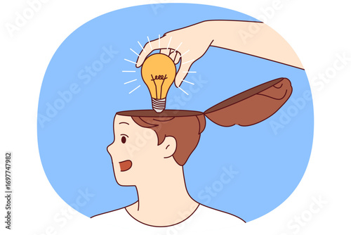 Mentor hand puts idea in shape of light bulb into man head, symbolizing training and valuable advice that causes personal development. Teacher giving idea to student during proper educational process