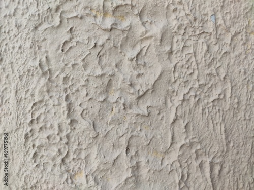 A rough popcorn ceiling with a bumpy, textured white finish, an abstract background for construction visuals or minimalist design projects.