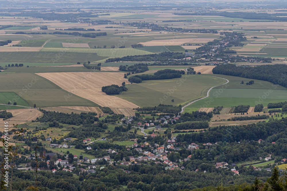 Naklejka premium Opawskie Mountains, Poland. View from the summit to the mountain valley of the Czech Republic and Poland.