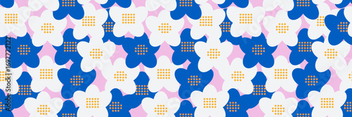 Seamless vector floral pattern with bold blue and white five petal flowers on a soft pink background. Playful dotted centers add a modern retro charm for textiles and decor.