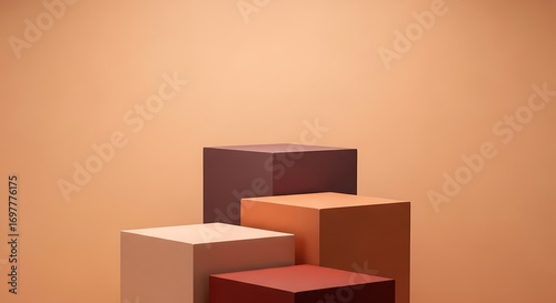 Three-dimensional display of four square blocks in varying shades of brown and orange.