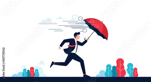 Man with umbrella running fast through stormy weather protecting himself from rain and wind