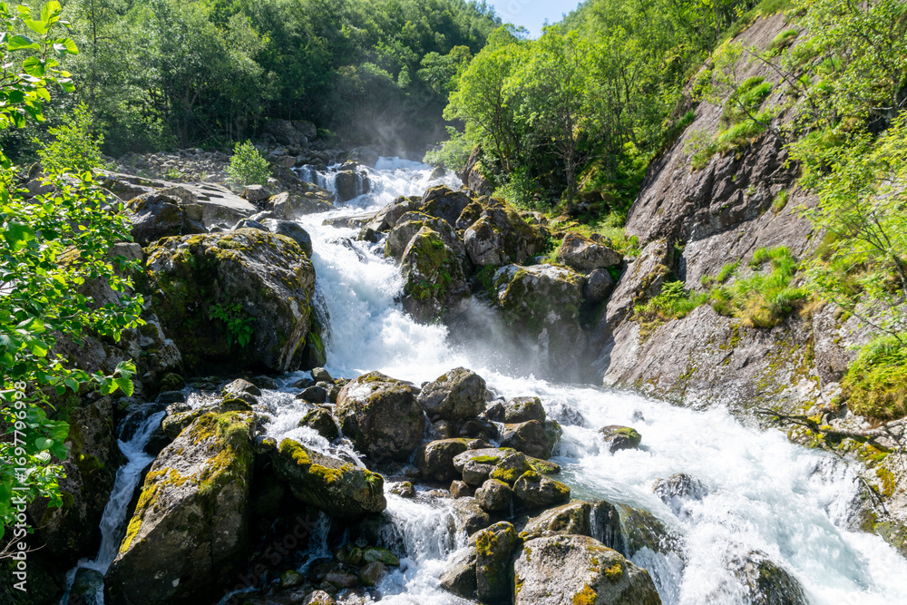 Naklejka premium Powerful Mountain Waterfall in Bondhusdalen, Vestland, Norway
