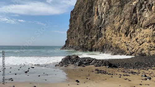 Ocean beach, waves crashing against the rocks on a sunny day. Oregon ocean beach