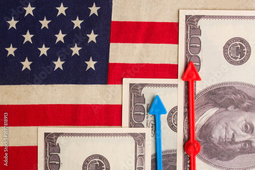 Dollars and growth charts against the background of the US flag