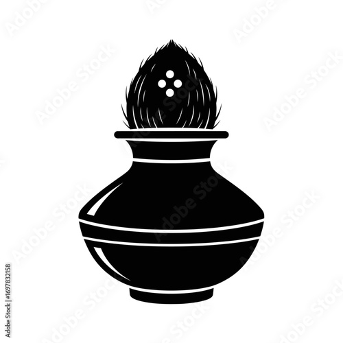 Silhouette of a traditional clay pot with a coconut atop, likely used in a cultural ceremony.