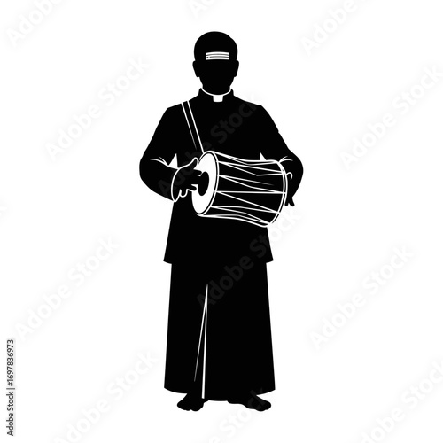Silhouette of a man playing a traditional drum, wearing a robe and head covering, standing upright.