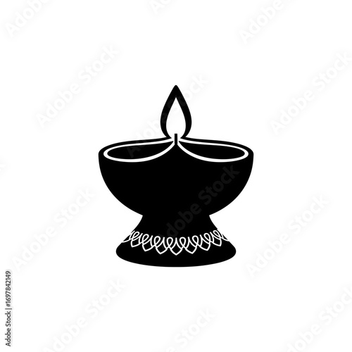 A black silhouette icon of a traditional Indian Diya oil lamp with a lit flame and decorated base.
