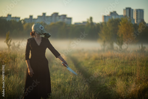 Fényképezés Creepy mysterious character wearing mask and gasmask in fog