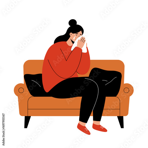 Young woman sitting on couch with hands on face and reflecting  