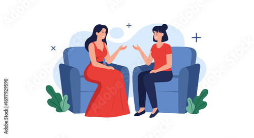 Two women engage in a meaningful conversation while seated comfortably on blue armchairs