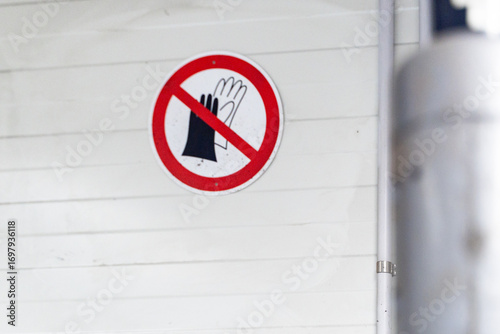 This is a Safety Sign that warns against any hand contact with certain equipment and zones
