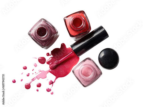 Assorted nail polish bottles and spills