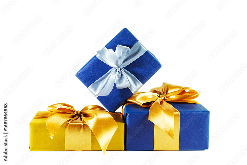 Fototapeta premium Elegant blue and gold gift boxes with bows isolated on white background.