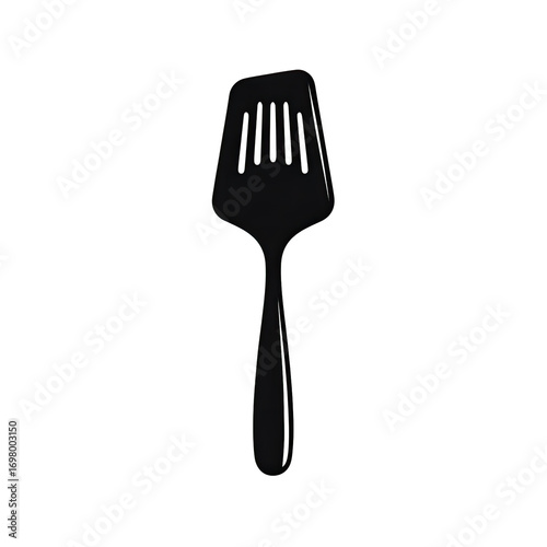 A simple spatula, angled slightly, against a black background