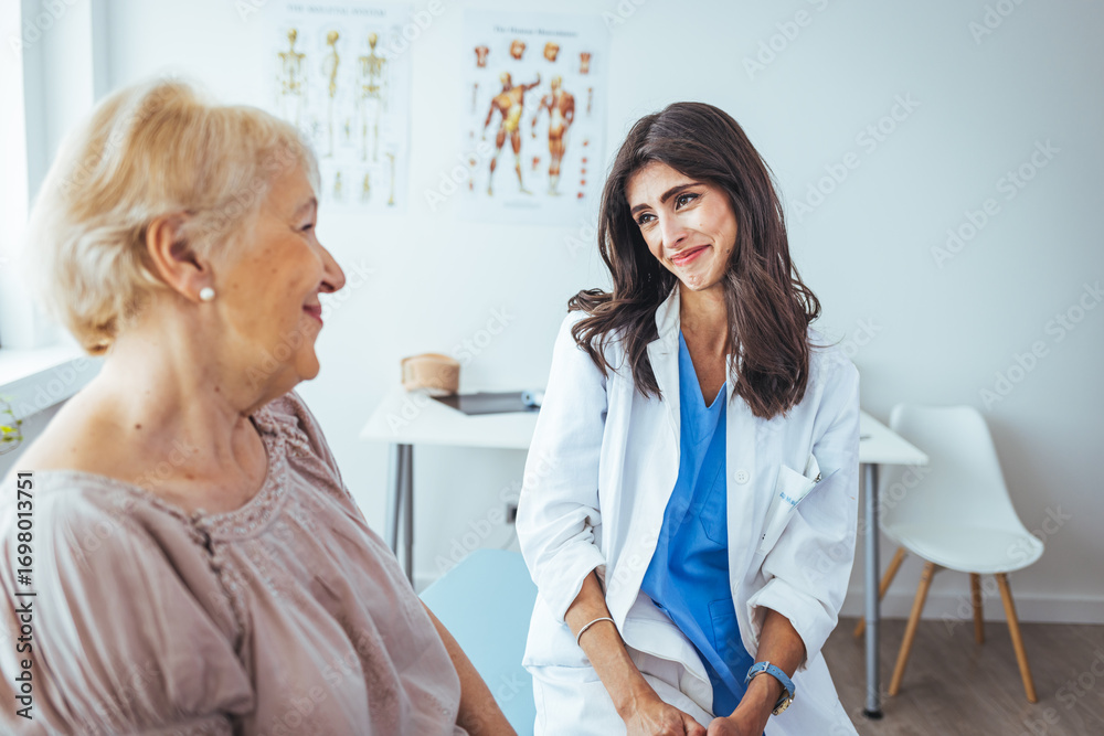 Fototapeta premium Doctor Consulting a Happy Elderly Patient in a Modern Medical Office
