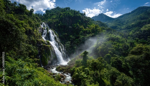 Lush waterfall cascading down mountainside