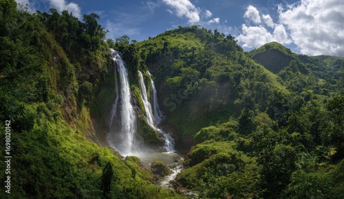 Lush green valley with cascading waterfall (1)