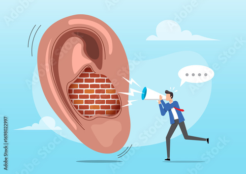 A large, human ear with a portion of the inner ear canal blocked by a red brick wall