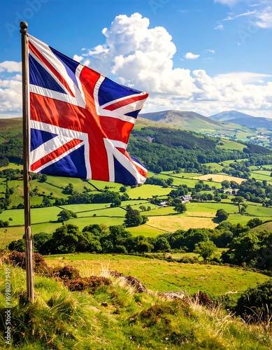 British flag waving over a verdant valley landscape