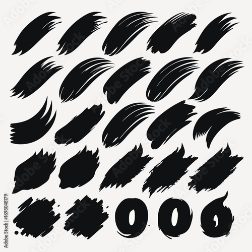 Collection of black brush strokes, various shapes and sizes, perfect for design elements.