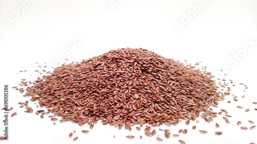 Pile of organic Flaxseeds rotating on a white background, Dry Linum usitatissimum