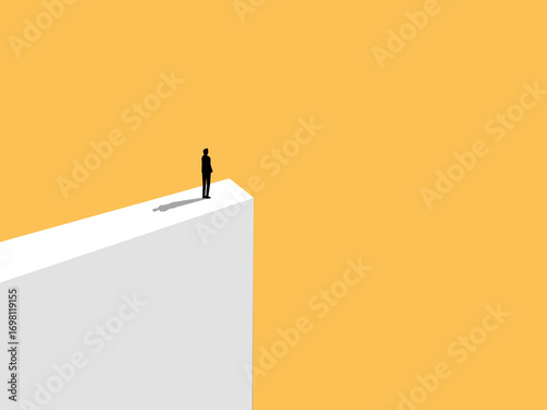 man standing on a high cliff
