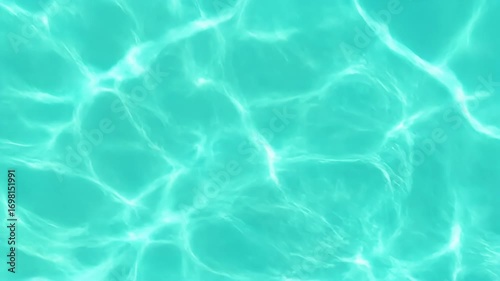 Turquoise water's surface, light reflecting, and rippling, creating soft, watery patterns