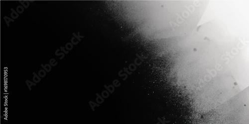 Silhouette of a man standing in water with misty smoke and light in the dark night sky