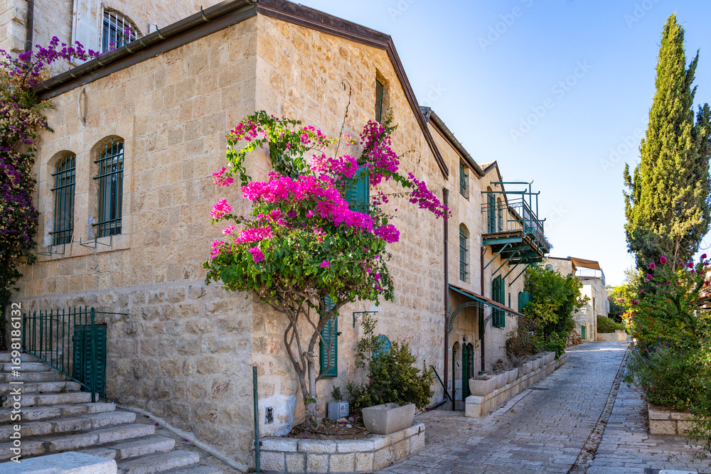 Fototapeta premium Historic street in the Mishkenot Sha'ananim(Yemin Moshe) neighborhood in Jerusalem