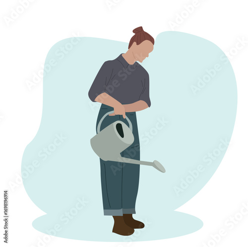 A gardening and a garden watering can. Woman holds watering can. 