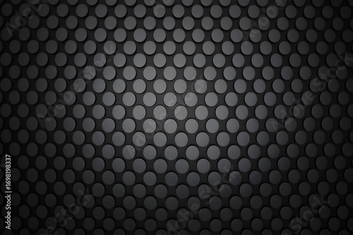 Dark gray perforated metal surface with a repeating circular pattern creating a modern industrial texture for backgrounds and design elements ideal for sleek and minimalist aesthetics on white backgro