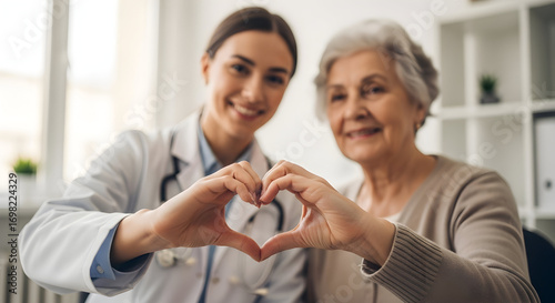 Compassionate Doctor and Senior Patient Forming Heart Shape with Hands Healthcare Medical Care Elderly