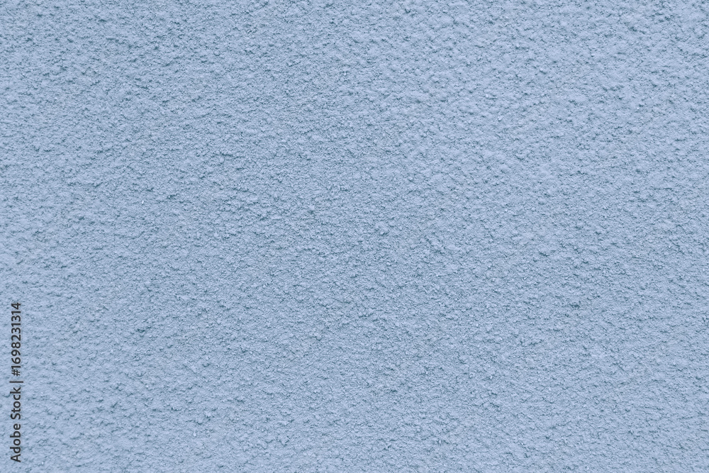 Fototapeta premium The blue concrete wall has a rough texture.