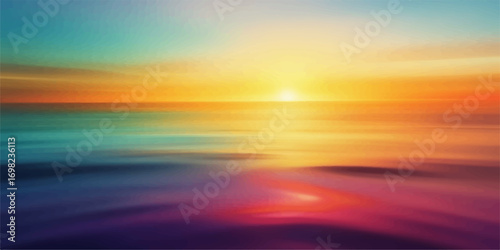 Sunset over the ocean with colorful sky and clouds reflecting on the water