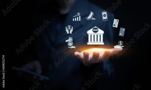 Businessman holding digital banking icons with mobile payment, credit card, investment, money transfer, and financial technology concept for modern online finance and innovation.